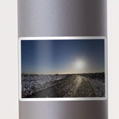 Sun Over Icy Road